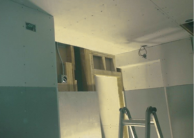 Putting-up more sheetrock.