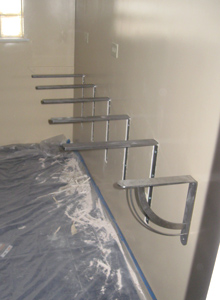 Stainless steel brackets installed to support the lunch counter.