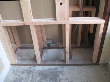 Framing around the sump pump housing.