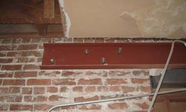 A steel channel from a prior seismic retrofit.