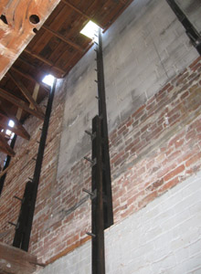 Steel ''strong backs'' were placed over epoxied bolts.
