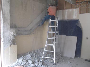 Removing the left-over remnants of an old stairway.