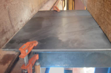 A steel plate was added on top of the angle iron pieces. 