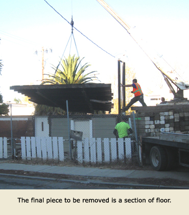 The final piece of the house move is lifted before being put on a Trost House Moving truck.
